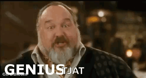 Man With Beard In Front Of Geniusjat Sign GIF