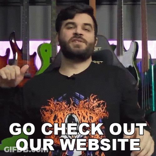 Man With Beard In Front Of Guitars Says Go Check Out Our Website GIF