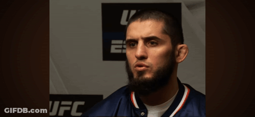 Man With Beard In Front Of Khabib.com Wall GIF