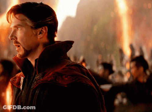 Man With Beard In Front Of Large Fire GIF