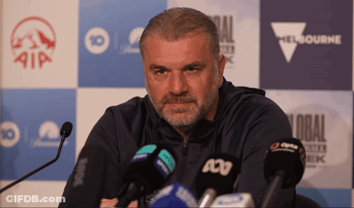 Man With Beard In Front Of Melbourne Sign GIF
