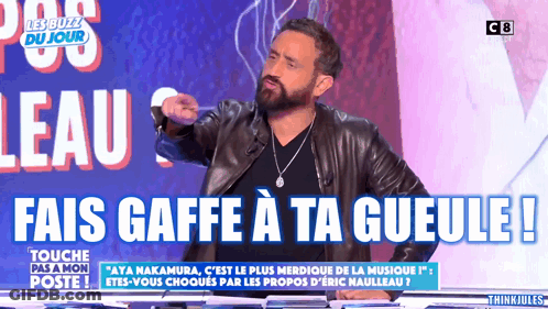Man With Beard In Front Of Sign Fais Gaffe A Ta Gueule GIF