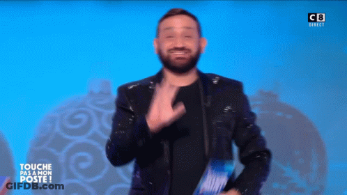 Man With Beard In Front Of Sign J'ai Commis Une Petite Bourde GIF