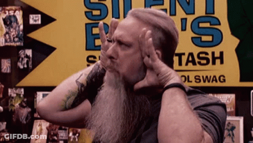 Man With Beard In Front Of Silent Bash Sign GIF