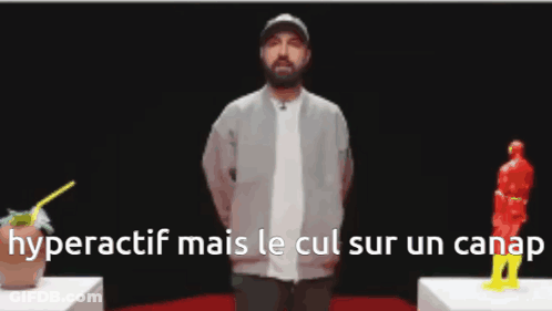 Man With Beard In Front Of Statue GIF