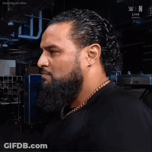 Man With Beard In Front Of WWE Live Austin Sign GIF