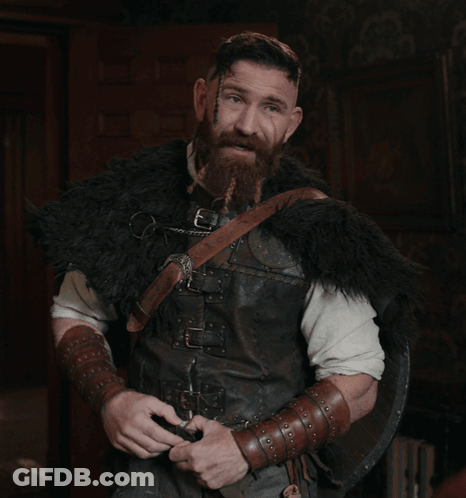 Man With Beard In Fur Coat And Shield Says I'm Smart GIF