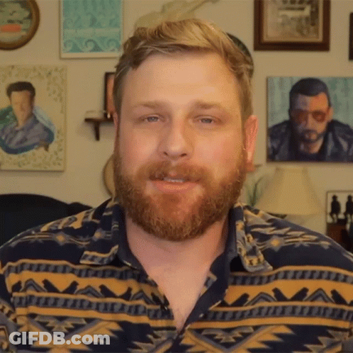 Man With Beard In Geometric Pattern Shirt GIF