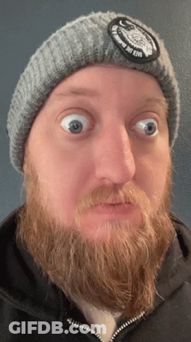 Man With Beard In Gray Beanie Saying Once In A Lifetime GIF