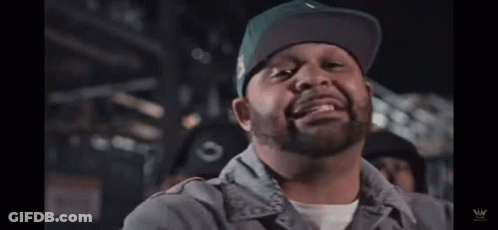 Man With Beard In Green Hat And Gray Shirt GIF