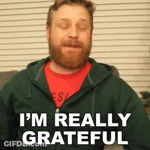 Man With Beard In Green Hoodie And Red Shirt Says Im Really Grateful GIF