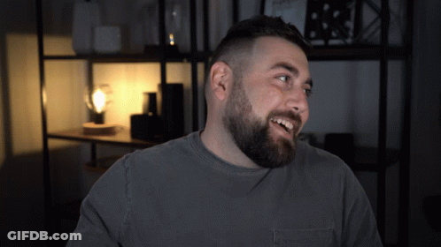 Man With Beard In Grey Shirt With Pocket GIF