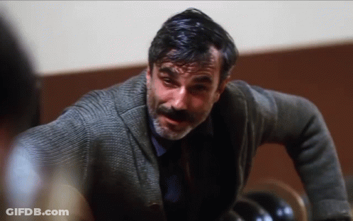 Man With Beard In Grey Sweater And Blue Shirt GIF
