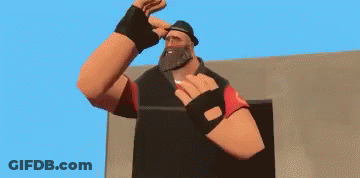 Man With Beard In Hat And Gloves Standing In Front Of Building GIF