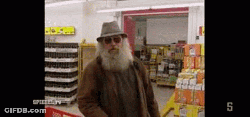 Man With Beard In Hat And Sunglasses At Supermarket GIF