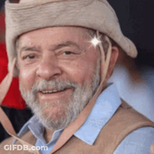 Man With Beard In Hat And Vest Smiling GIF