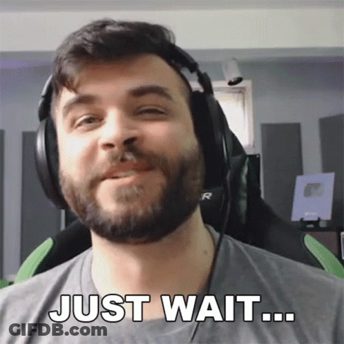 Man With Beard In Headphones Says Just Wait GIF