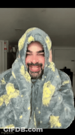 Man With Beard In Hooded Blanket GIF