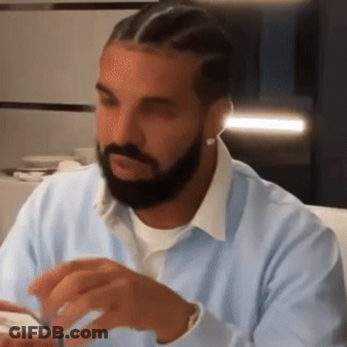 Man With Beard In Light Blue Shirt And Earrings GIF