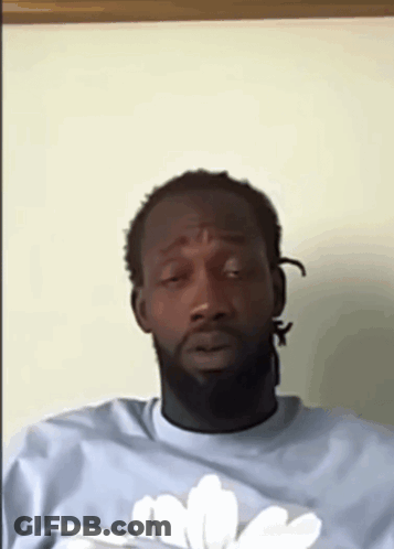 Man With Beard In Light Blue Shirt With White Flower GIF