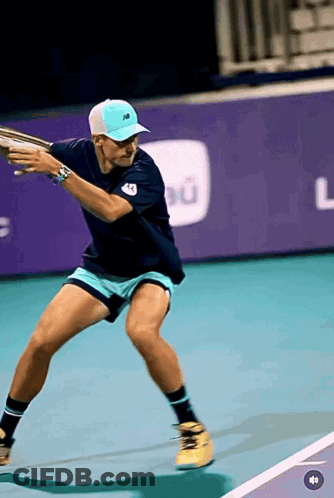 Man With Beard In New Balance Shirt Wiping Face GIF