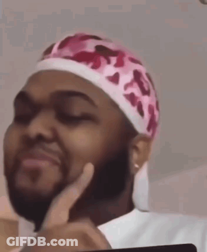 Man With Beard In Pink Headband Making Face GIF