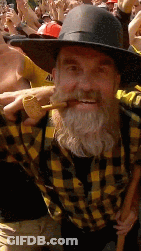 Man With Beard In Plaid Shirt And Hat Holding Pipe GIF