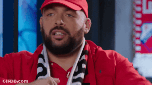 Man With Beard In Red Hat And Scarf Saying Supreme GIF