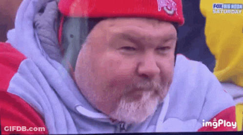Man With Beard In Red Hat And White Jacket GIF