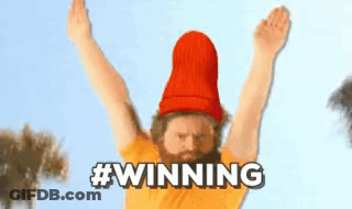 Man With Beard In Red Hat And Yellow Shirt Raising Arms GIF
