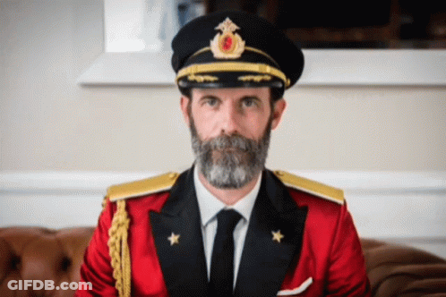 Man With Beard In Red Suit And Black Hat GIF