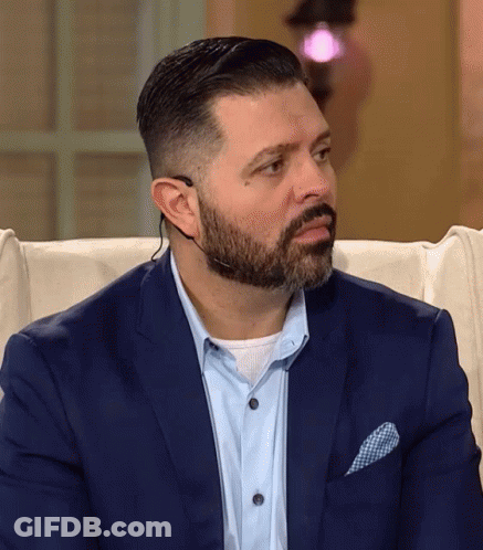 Man With Beard In Suit And Headset GIF