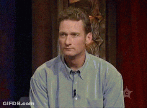 Man With Beard In Suit Sitting GIF
