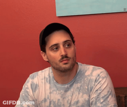 Man With Beard In Tie Dye Shirt And Hat GIF