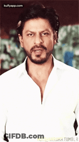 Man With Beard In White Shirt Looking At Camera GIF