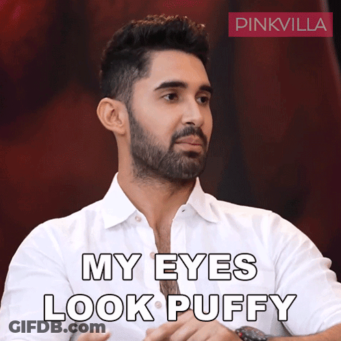 Man With Beard In White Shirt Saying My Eyes Look Puffy GIF