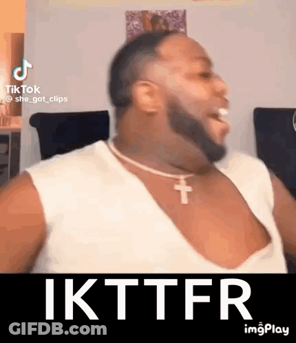Man With Beard In White Tank Top And Cross Necklace GIF
