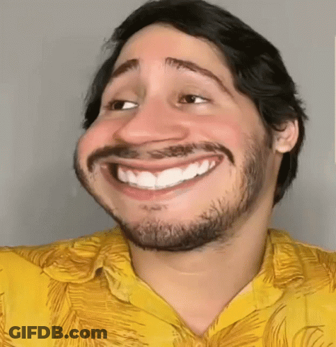 Man With Beard In Yellow Shirt Smiling GIF