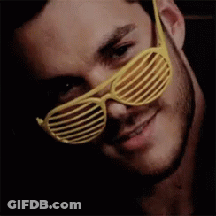 Man With Beard In Yellow Shutter Glasses GIF