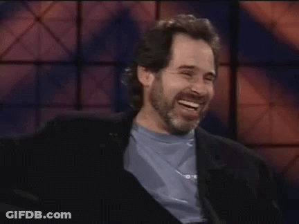 Man With Beard Laughing In Blue Shirt GIF