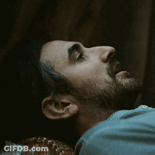 Man With Beard Laying Down Eyes Closed GIF