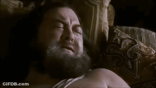 Man With Beard Laying In Bed Saying Give Me Something For The Cringe And Let Me Die GIF