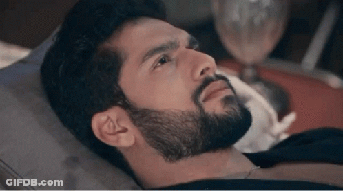 Man With Beard Laying On Bed GIF