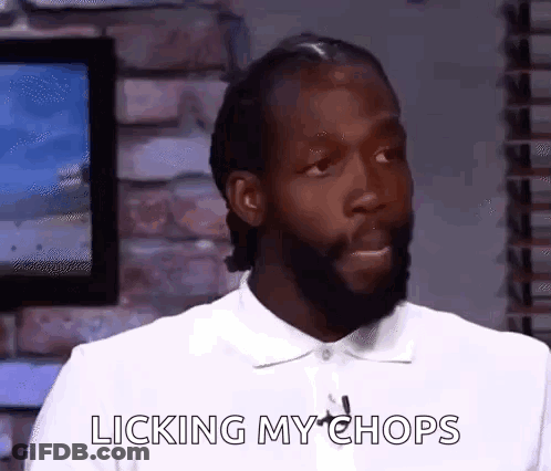 Man With Beard Licking Lips GIF