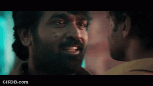 Man With Beard Looking At Another Man GIF