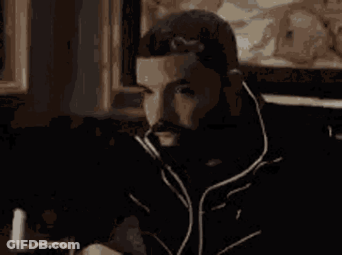 Man With Beard Looking At Cell Phone GIF