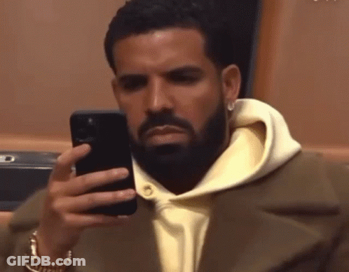 Man With Beard Looking At Phone GIF