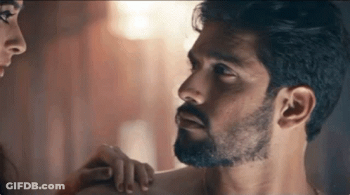 Man With Beard Looking At Woman Touching Shoulder GIF