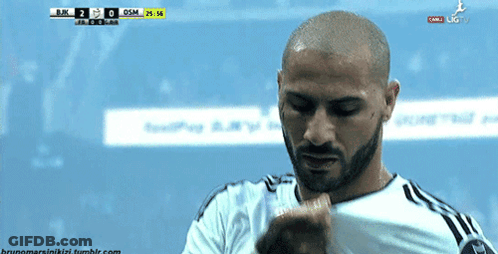 Man With Beard Looking Down At BJK Scoreboard GIF