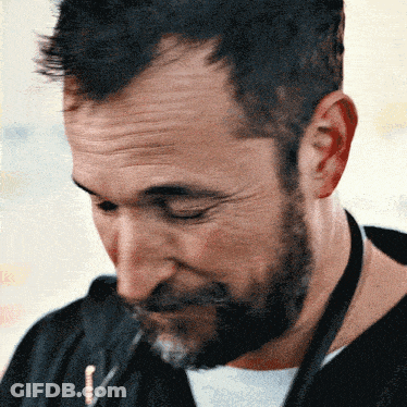 Man With Beard Looking Down GIF